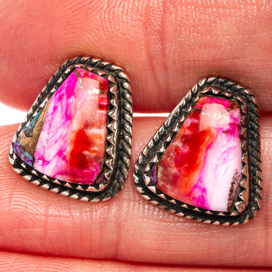 Sterling silver teardrop earrings showing pink-red-purple cabochon with border detailing