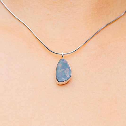 Sterling silver necklace with teardrop fire opal pendant, blue teardrop setting