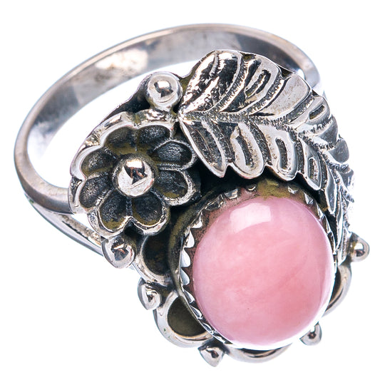 Sterling silver ring with round pink opal cabochon, flower cluster and leaf accents