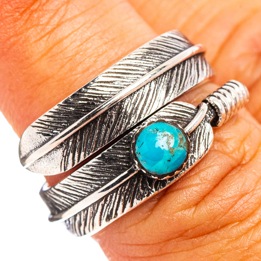 Sterling silver feather ring with turquoise stone, adjustable open band.