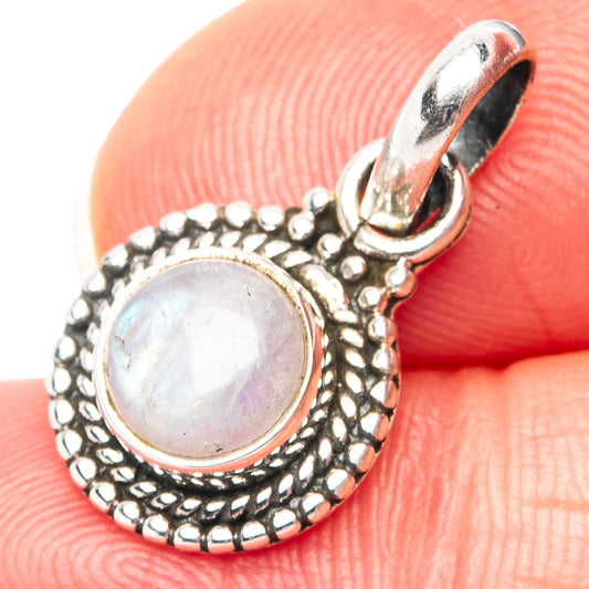 Sterling silver moonstone pendant with round opalescent cabochon and ornate bead border