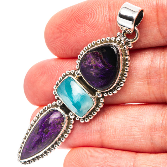 Sterling silver triple-stone pendant with purple and blue teardrop gemstones