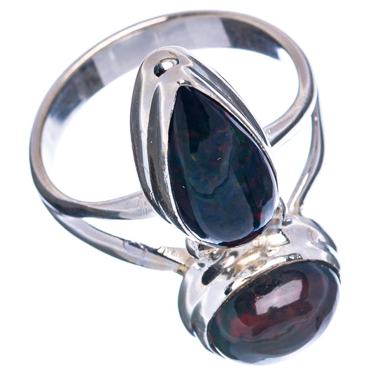 Sterling silver ring with oval black opal centerpiece and matching teardrop stone