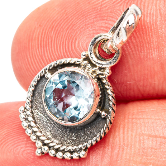 925 sterling silver blue gemstone teardrop pendant with ornate bezel and bail