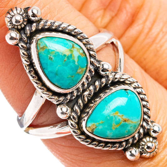 Turquoise double oval cabochon sterling silver ring with detailed bead border, close-up