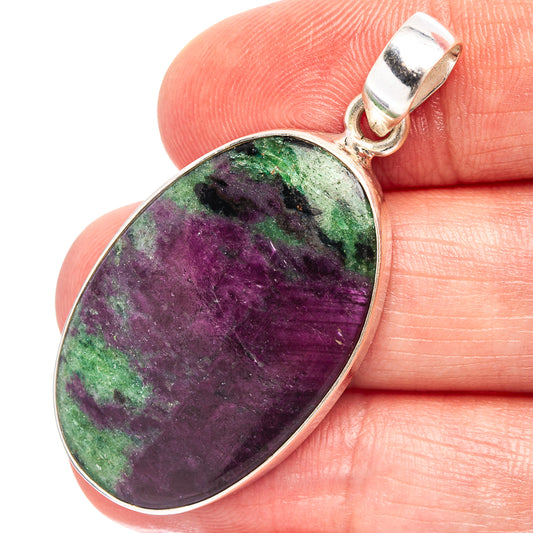 Ruby zoisite pendant in oval sterling silver bezel with purple and green stone.