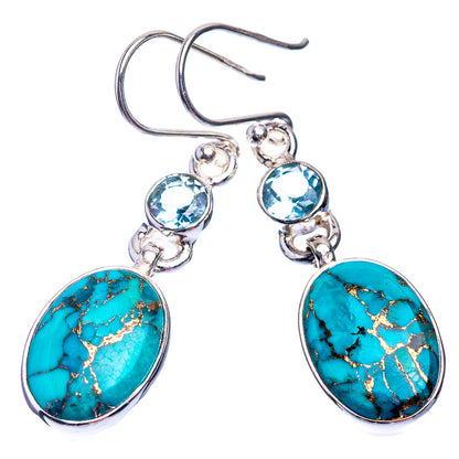 Turquoise oval drop earrings with blue round accents and sterling silver hooks