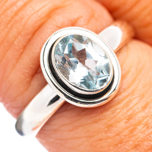 Sterling silver ring with oval blue topaz center stone, size 8