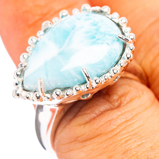 Sterling silver larimar ring with oval light blue cabochon and beaded halo