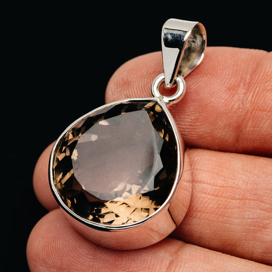 Smoky quartz teardrop pendant in .925 sterling silver with faceted stone bezel