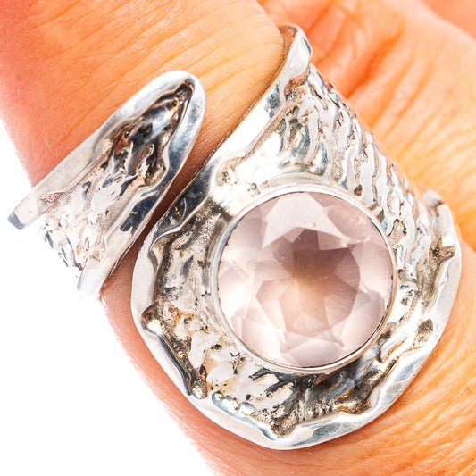 Adjustable .925 sterling silver rose quartz ring with oval pink stone, textured bezel