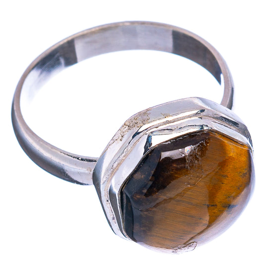 Sterling silver ring with tiger's eye oval cabochon, size 7.25, beveled band.