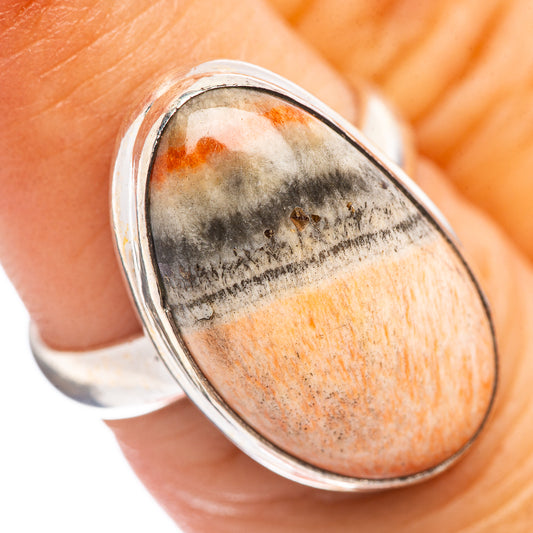 Sterling silver oval cabochon ring with orange, gray, and black banded stone