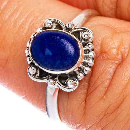 925 silver ring close-up: oval blue lapis lazuli cabochon in ornate bezel setting