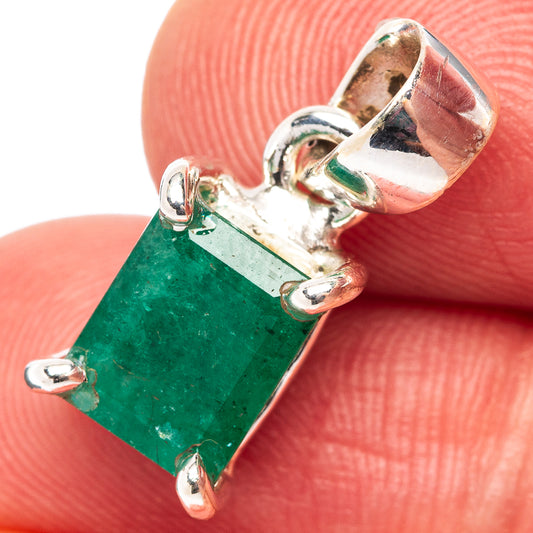 Green emerald rectangle pendant with .925 sterling silver bezel and prong details