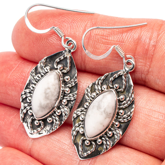 Sterling silver howlite drop earrings with oval white stone and ornate filigree, hooks