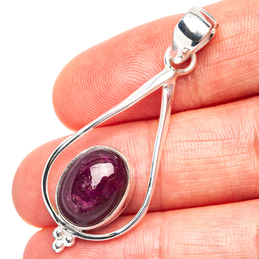 Sterling silver ruby teardrop pendant with round red gemstone in ornate frame