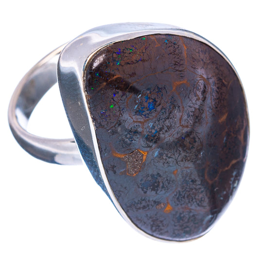 Sterling silver ring with oval boulder opal, dark brown base with blue-green flashes
