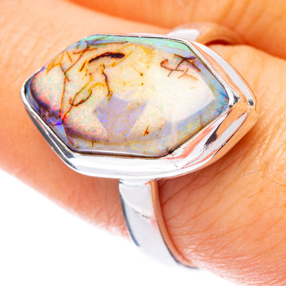 Sterling silver opal ring with pear-shaped iridescent stone, open bezel