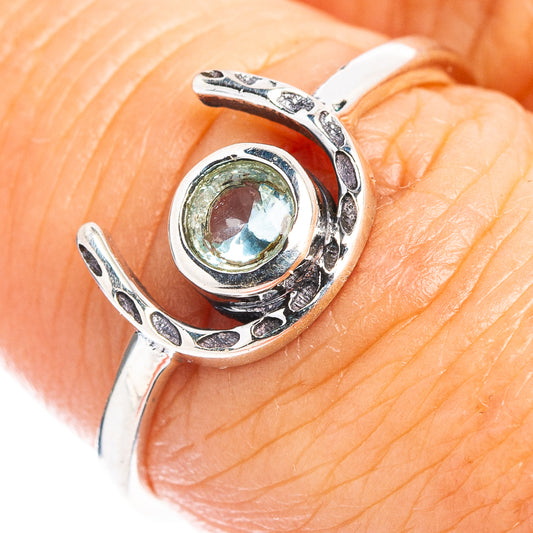 Sterling silver horseshoe dainty ring with oval blue topaz gemstone