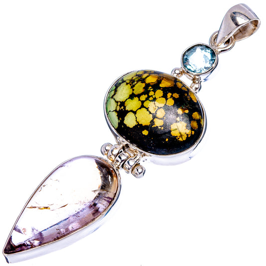 Sterling silver pendant with oval black-gold cabochon, purple pear-shaped stone, and blue top