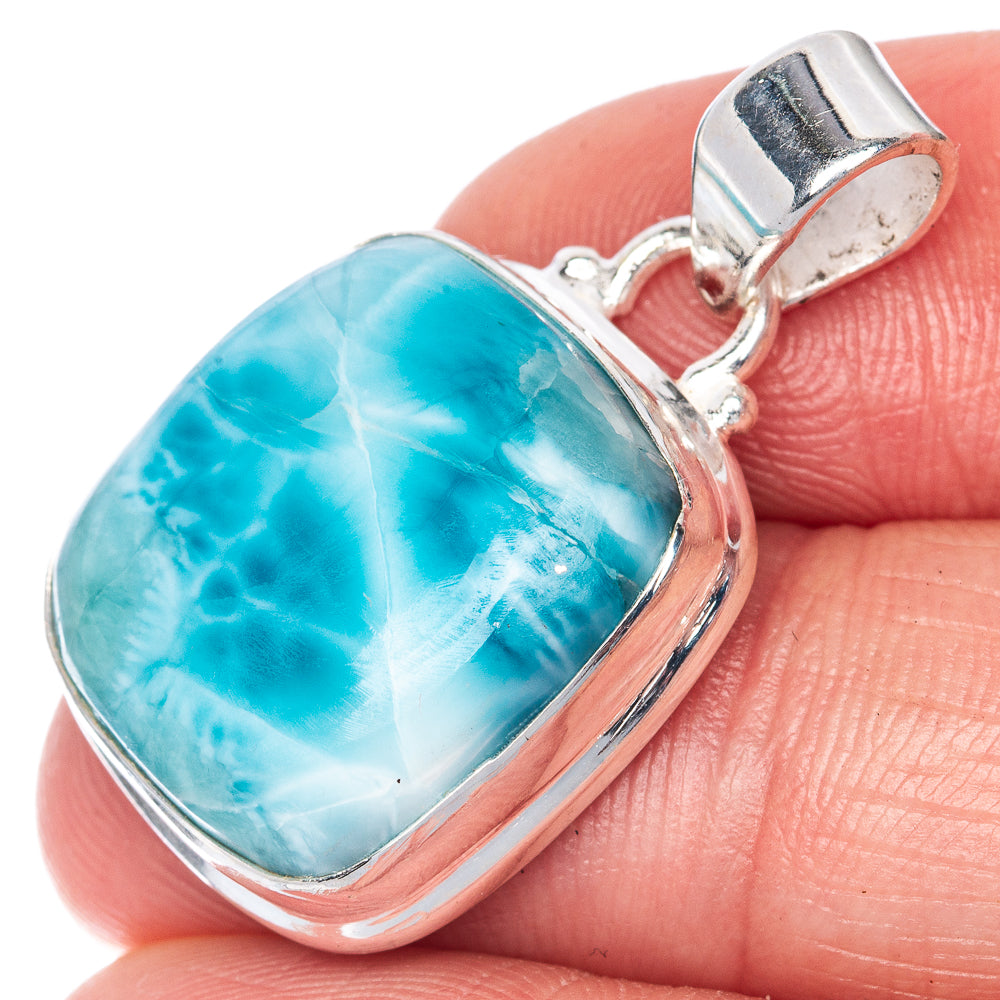 Oval larimar cabochon pendant in silver bezel with open bail
