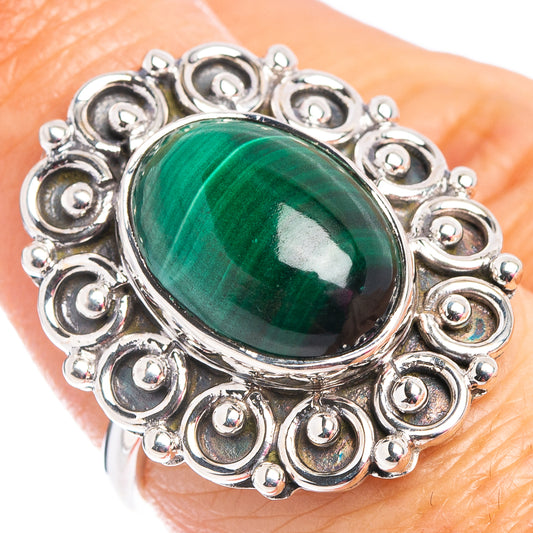 Size 7 sterling silver malachite oval ring on finger, ornate beaded halo
