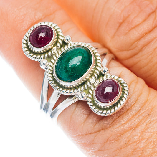 Sterling silver three-stone ring: green oval center, two red oval gemstones