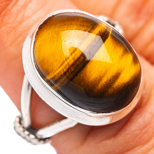 Sterling silver ring close-up, oval golden tiger's eye cabochon