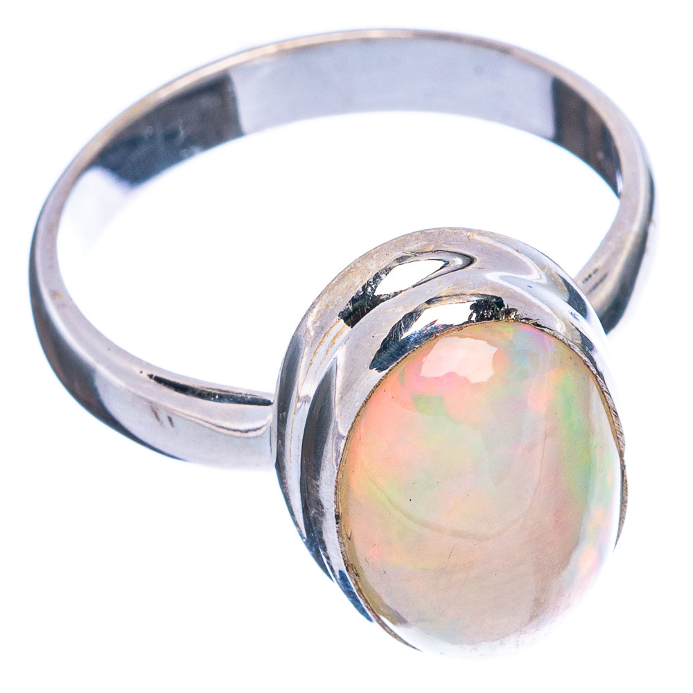 Sterling silver opal ring, oval opal set on wide band with prongless bezel