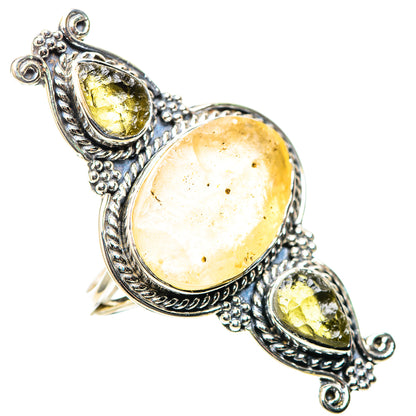 Sterling silver ring with large oval pale gold stone and two yellow teardrop accents
