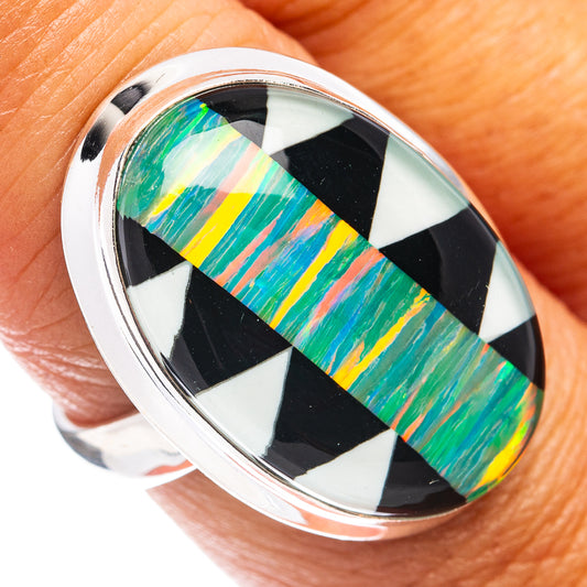 Sterling silver oval opal ring with black-and-white checker bezel and green-blue inlay