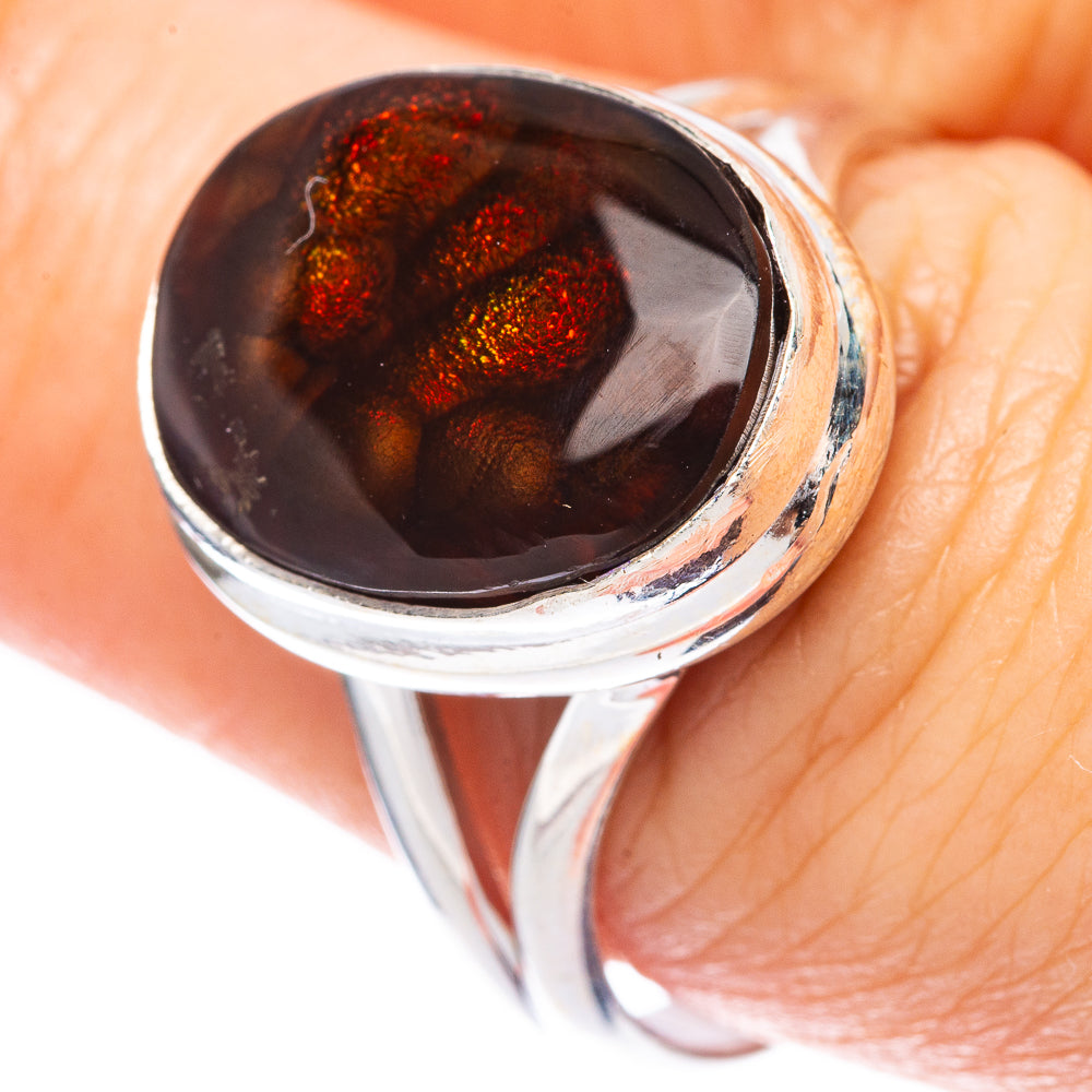 Sterling silver ring with oval dark fire agate stone and red glittery flecks