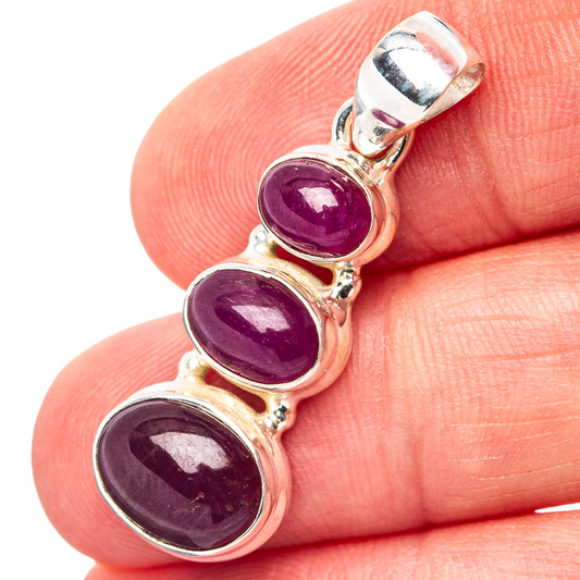 Three-stone ruby pendant in .925 sterling silver with three oval purple gemstones