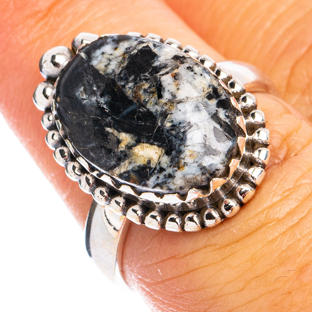 Sterling silver ring with oval black-and-white turquoise cabochon and beaded halo