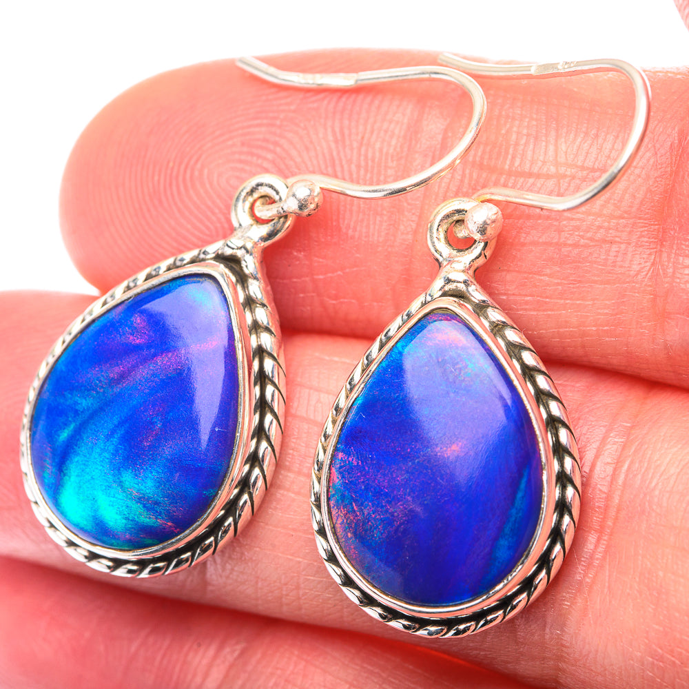 Sterling silver teardrop opal earrings with blue iridescent stone and twisted border