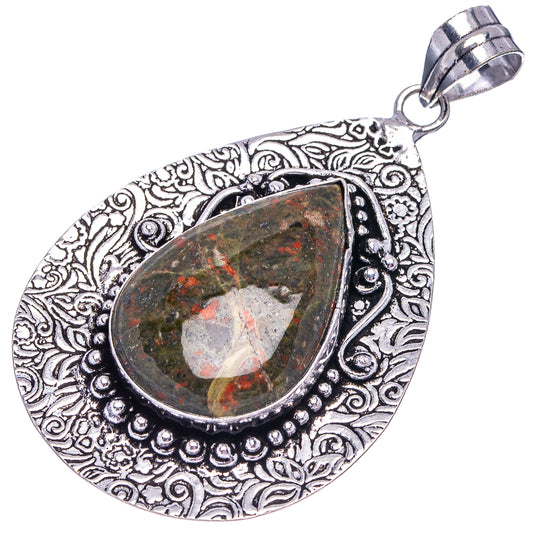 German silver teardrop pendant with unakite cabochon and swirling etched frame