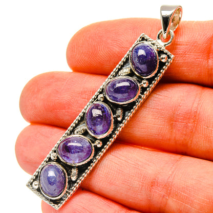Four-stone oval blue pendant in sterling silver with top bail and bezel settings