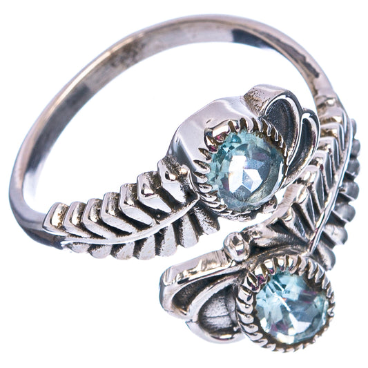 Sterling silver adjustable ring with two faceted blue topaz stones and ornate band