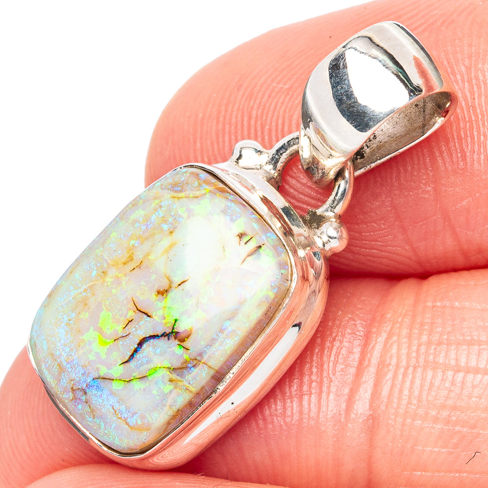 Oval opal pendant in .925 sterling silver with open bail; white, blue, and green flashes.