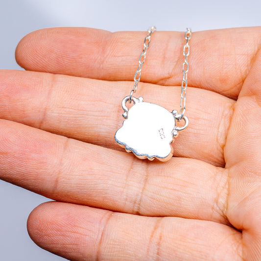 Turquoise inlay sterling silver necklace with clover-shaped white pendant on chain