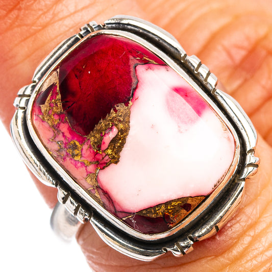 Sterling silver oval cabochon ring with red-pink stone and gold matrix in bezel