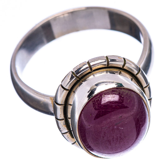 Sterling silver gemstone ring, purple oval cabochon in segmented bezel on band