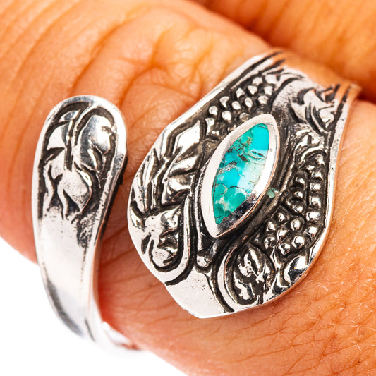 Turquoise oval cabochon sterling silver ring with ornate stamped side details