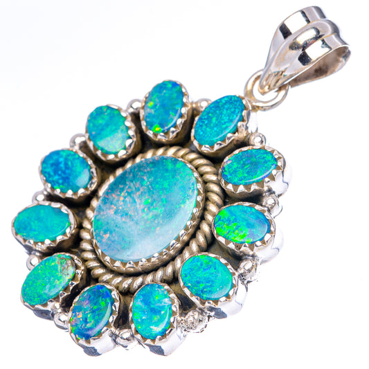 Sterling silver opal doublet pendant featuring blue-green oval center and scalloped halo