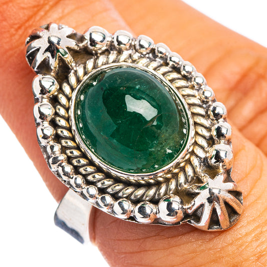 Silver emerald ring with round green gemstone in ornate beaded bezel