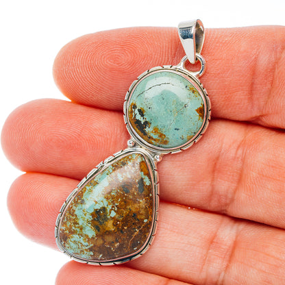 Turquoise double-oval sterling silver pendant with two stone settings