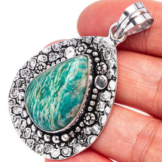 German-silver amazonite teardrop pendant with textured bezel and turquoise stone, top bail