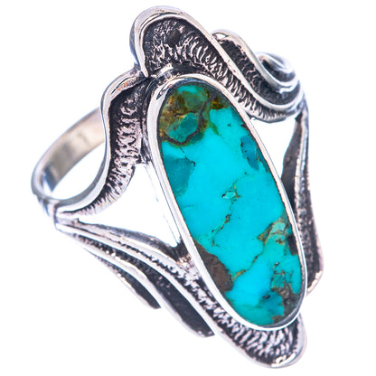 Sterling silver turquoise cabochon ring with oval blue-green stone and etched vintage band