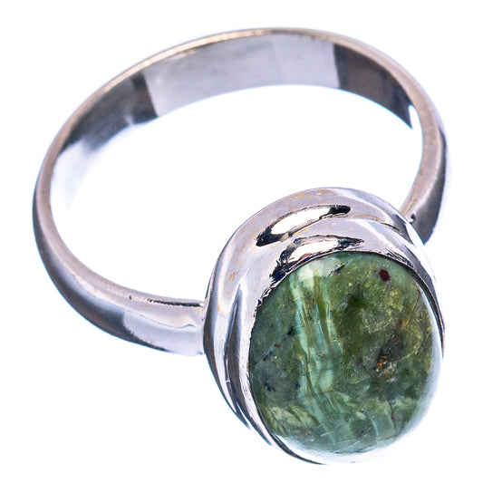 Green opal cabochon ring with .925 sterling silver band, side view of oval stone